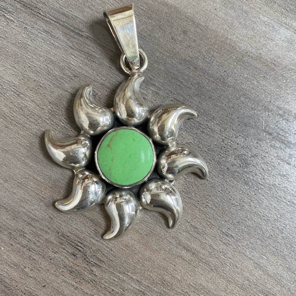 Silver with light green stone pendant
